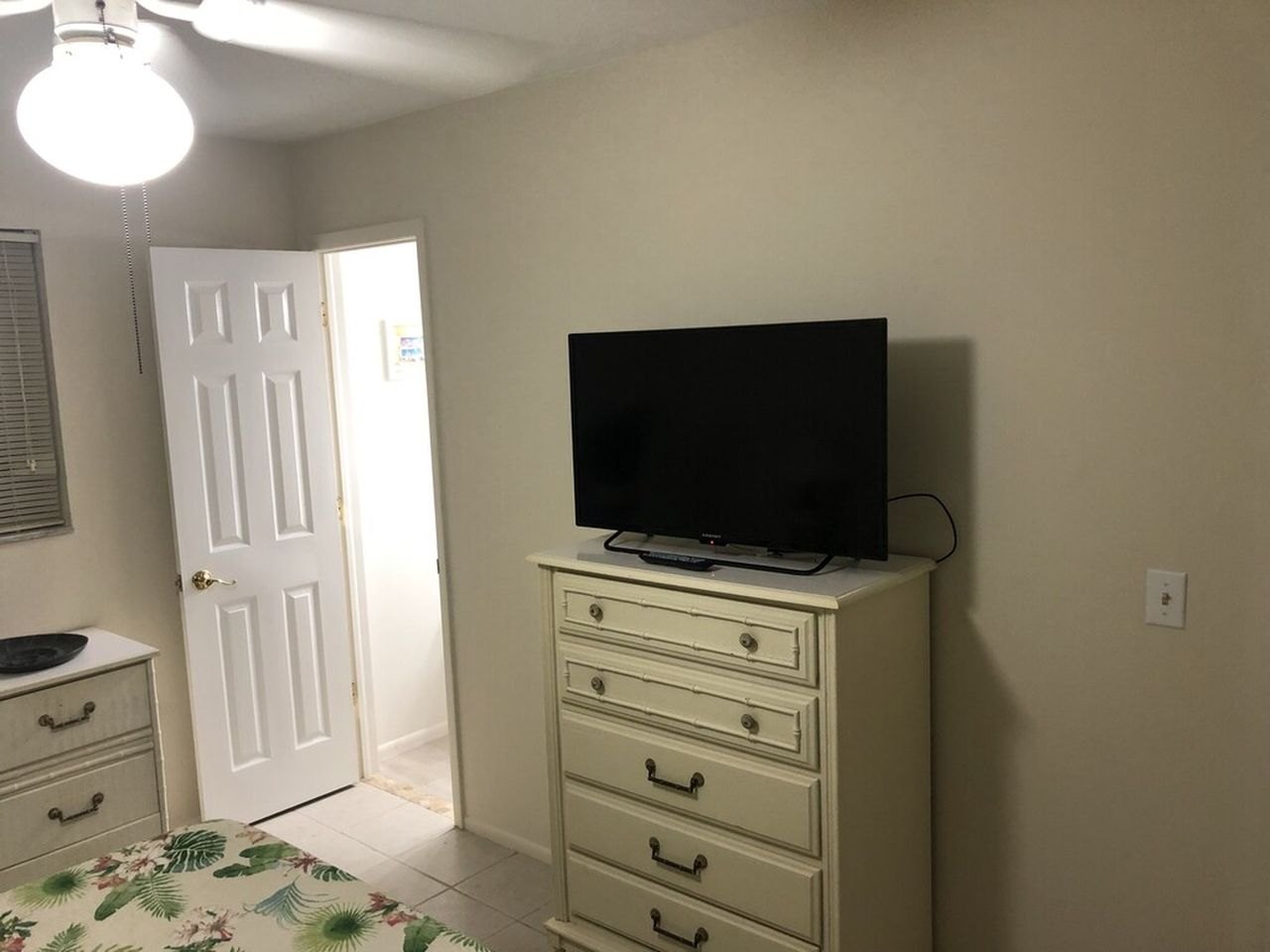 Bedroom television and dresser at San Carlos Paradise