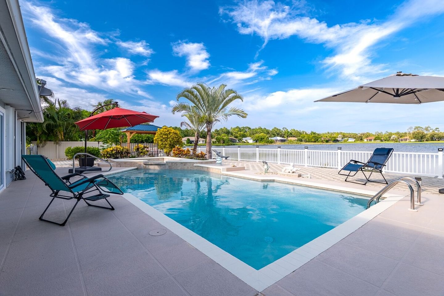 Pool seating and lake view at the lakefront spa house
